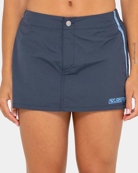 Image of a model wearing Skirts. Productname: rusty - Womens Lombardi Nylon Mini Skirt - Navy - in Navy colour by brand - rusty