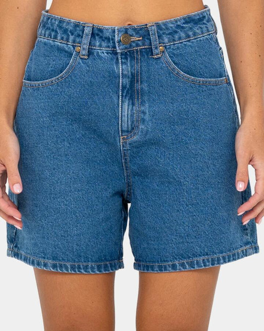 Image of a model wearing Shorts. Productname: rusty - Womens Cyprus High Denim Shorts - Middy Blue - in Middy Blue colour by brand - rusty