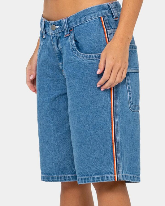 Image of a model wearing Shorts. Productname: rusty - Womens Flip Mommy Low Rise Denim Shorts - Middy Blue / Orange - in Middy Blue / Orange colour by brand - rusty