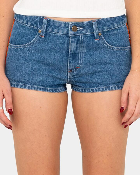 Image of a model wearing Shorts. Productname: rusty Womens Flip Mommy Low Rise Micro Denim Shorts Mid Blue - in Mid Blue colour by brand - Rusty