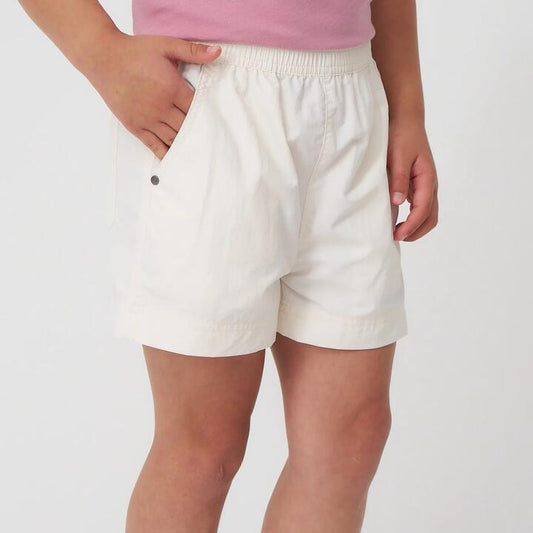 Image of a model wearing Shorts. Productname: Torpedo7 Girls Salamander Shorts V2 in GARDENIAWH colour by brand - TORPEDO7