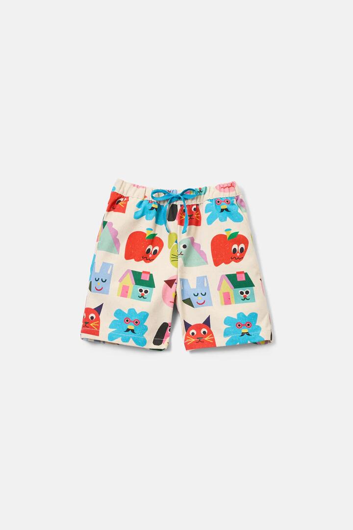 Image of a model wearing Shorts. Product name - Birthday Kids Shorts in Cream colour by brand - Gorman