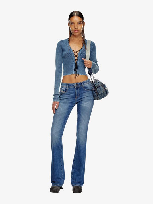 Image of a model wearing Denim. Productname: Diesel 1969 D-Ebbey Flare Jean in Blue colour by brand - Diesel