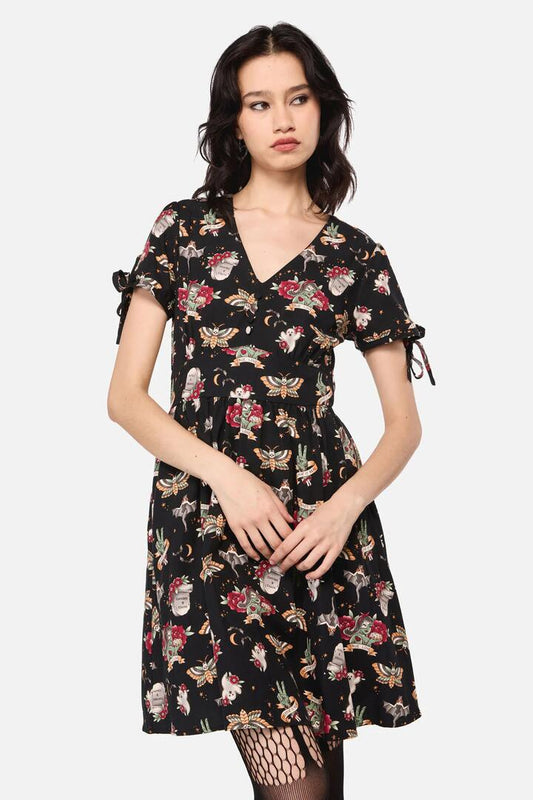 Image of a model wearing Tops. Productname: All Hallows Eve Tattoo Print Short Sleeve Dress in Black colour by brand - Dangerfield