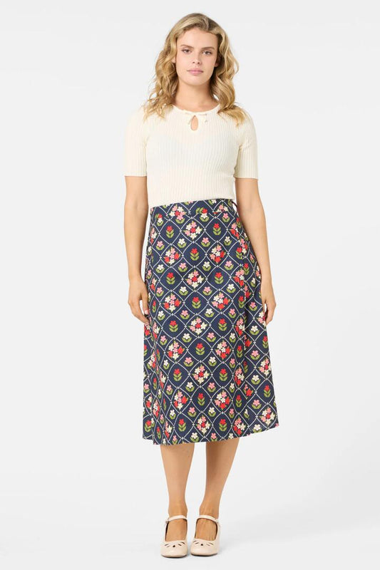 Image of a model wearing Skirts. Productname: Judy Wrap Midi Skirt in Navy colour by brand - Princess Highway
