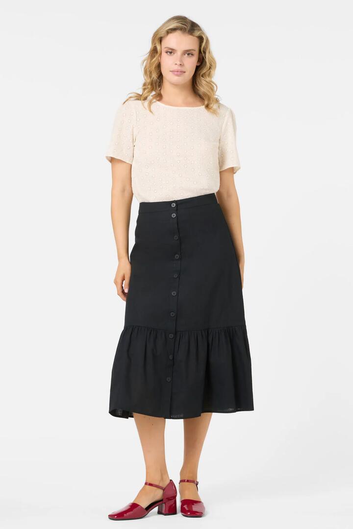 Image of a model wearing Skirts. Productname: Jolie Button Front Midi Skirt in Black colour by brand - Princess Highway