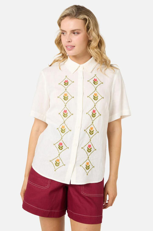 Image of a model wearing Tops. Productname: Flower Girl Embroidered Shirt in Cream colour by brand - Princess Highway