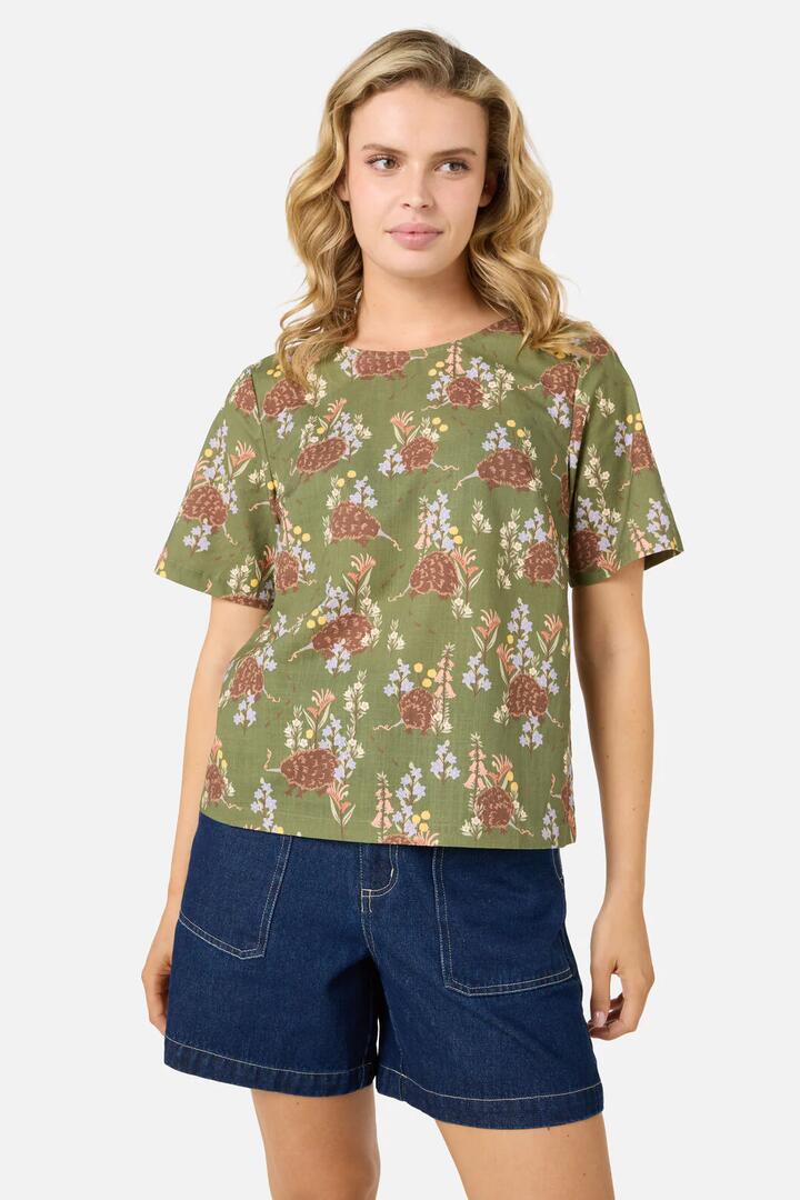 Image of a model wearing Tops. Productname: Echidna Short Sleeve Top in Green colour by brand - Princess Highway