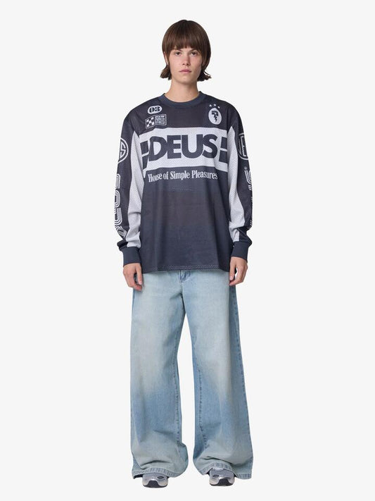 Image of a model wearing Tops. Productname: Deus Off Road Mx Jersey 2.0 in Black colour by brand - Deus