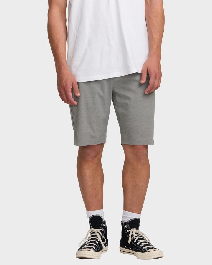 Image of a model wearing Shorts. Product name - Billabong Mens Crossfire 21" Hybrid Shorts Grey - in Grey colour by brand - Billabong