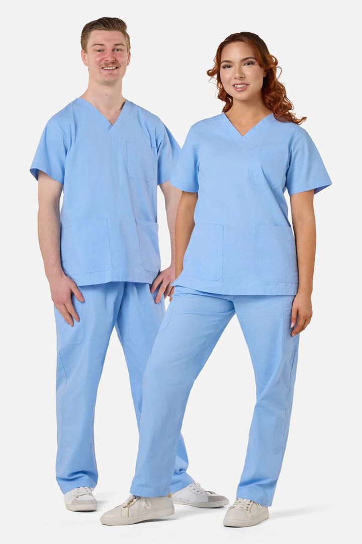 Image of a model wearing Uniforms & Workwear. Product name - Scrubswithlove Blue Scrub Set in Light Blue colour by brand - Scrubs With Love