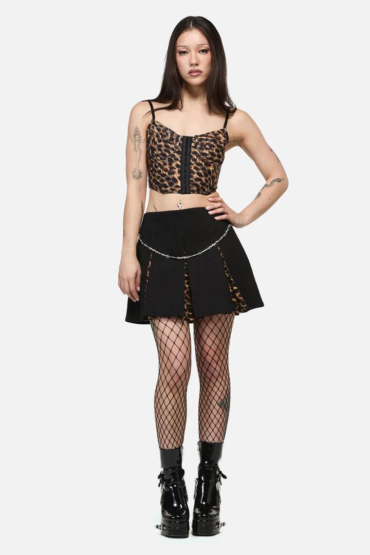 Image of a model wearing Skirts. Product name - Leopard Contrast Pleat Grunge Skort in Black colour by brand - Dangerfield