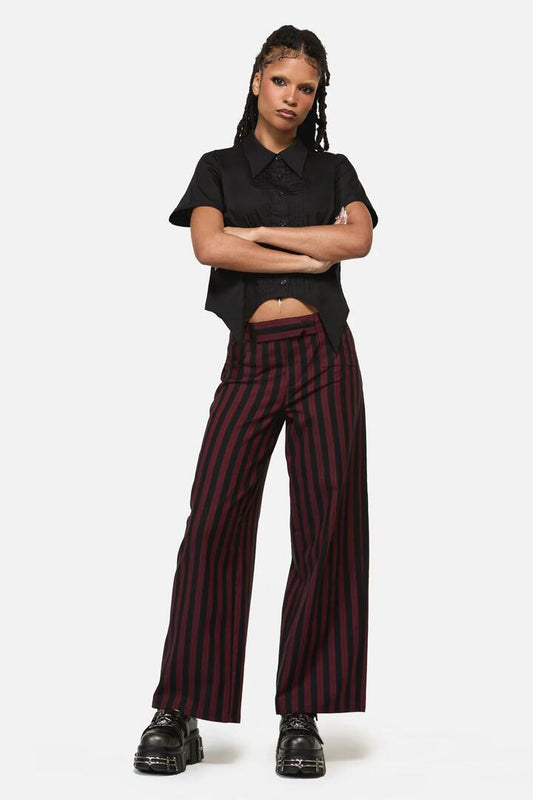 Image of a model wearing Pants. Productname: Sucker Pinstripe Goth Pant in Black/Red colour by brand - Black Friday