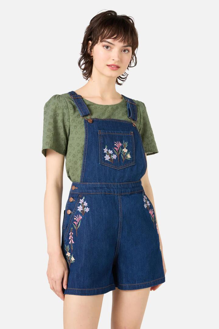 Image of a model wearing Pants. Productname: Eva Embroidered Short Overalls in Blue Denim colour by brand - Princess Highway