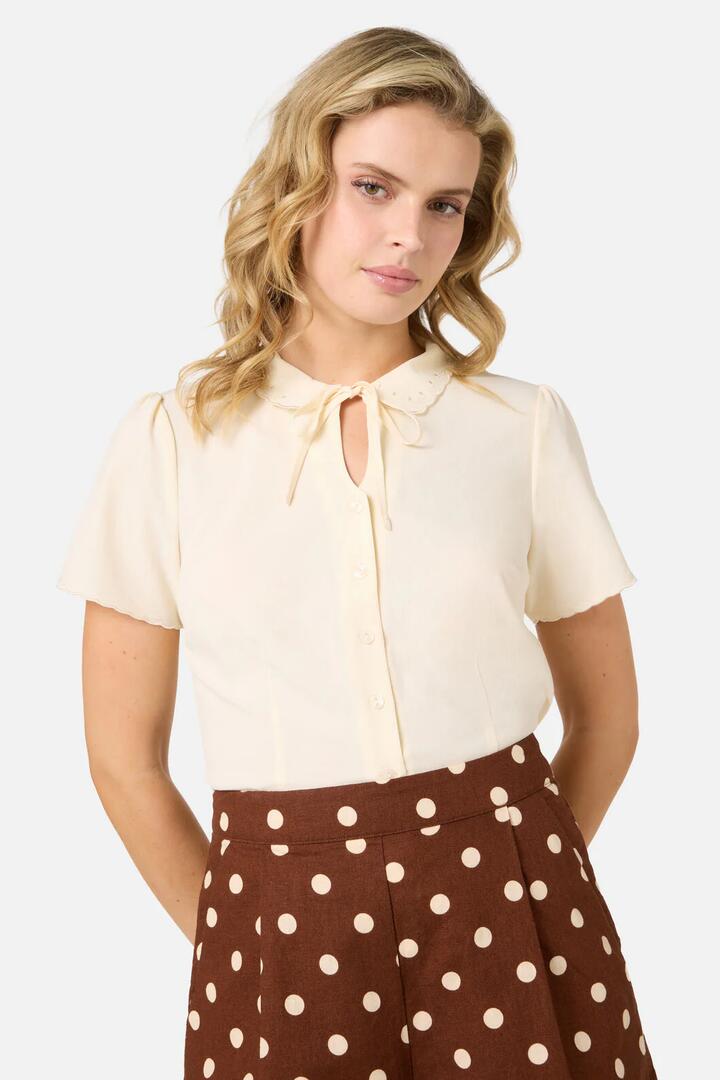 Image of a model wearing Tops. Productname: Josie Short Sleeve Blouse in Cream colour by brand - Princess Highway
