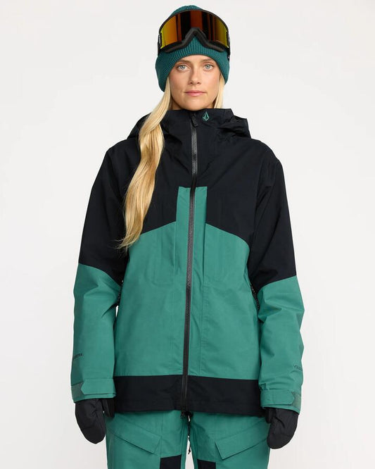 Image of a model wearing Outerwear. Productname: Volcom Womens At Stretch Gore-Tex Snow Jacket Spruce Green - in Spruce Green colour by brand - Volcom