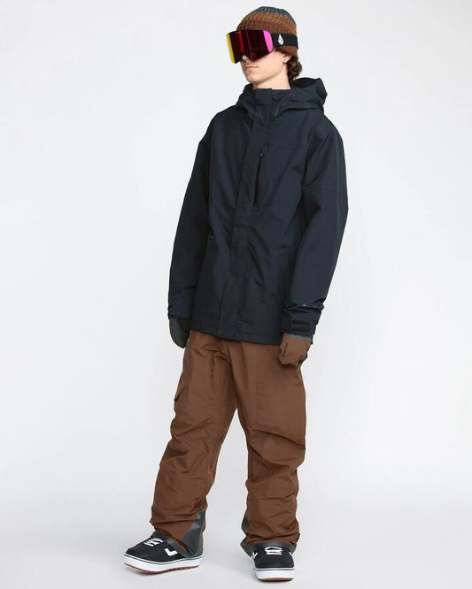 Image of a model wearing Pants. Productname: Volcom Mens Rain Gore-Tex Bib Snow Pants Brown - in Brown colour by brand - Volcom