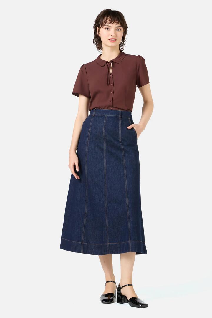 Image of a model wearing Skirts. Productname: Ophelia Dark Denim Skirt in Dark Denim colour by brand - Princess Highway
