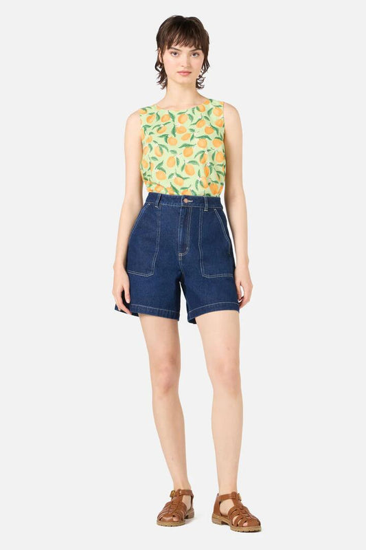 Image of a model wearing Shorts. Productname: Reece Denim Short in Dark Denim colour by brand - Princess Highway