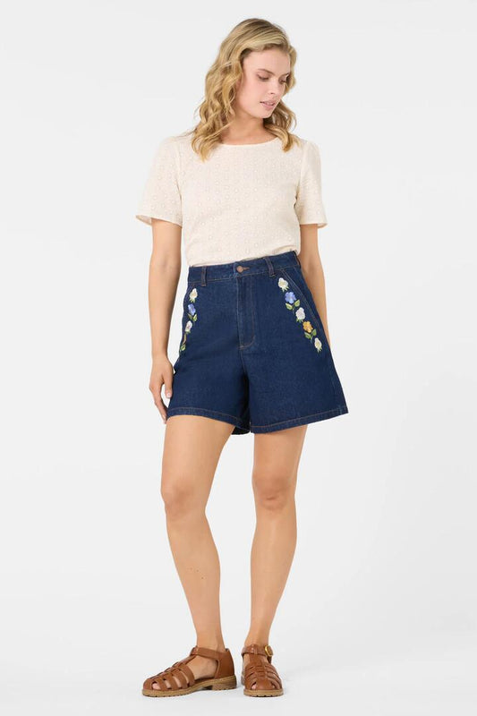 Image of a model wearing Shorts. Productname: Blooms Embroidered Short in Blue Denim colour by brand - Princess Highway
