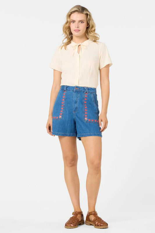 Image of a model wearing Shorts. Productname: Flower Girl Embroidered Shorts in Blue Denim colour by brand - Princess Highway