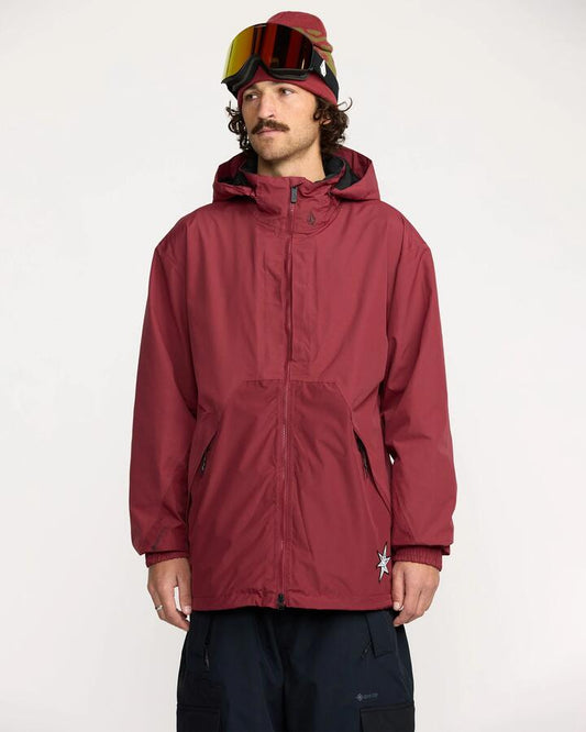 Image of a model wearing Outerwear. Productname: Volcom Mens Longo Gore-Tex Snow Jacket Burnt Red - in Burnt Red colour by brand - Volcom