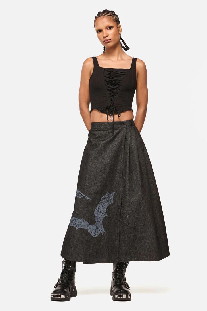 Image of a model wearing Skirts. Product name - Batz Denim Midi Pleated Skirt in Black colour by brand - Black Friday