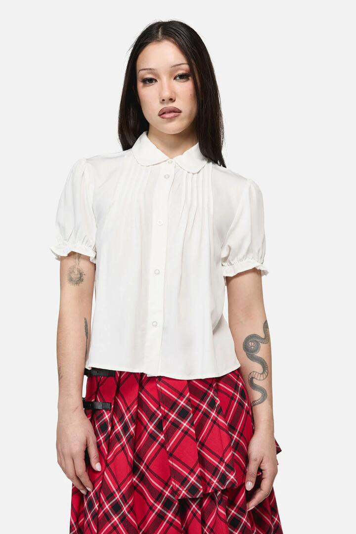 Image of a model wearing Tops. Productname: Buccaneer Punk Short Sleeve Blouse in Cream colour by brand - Dangerfield
