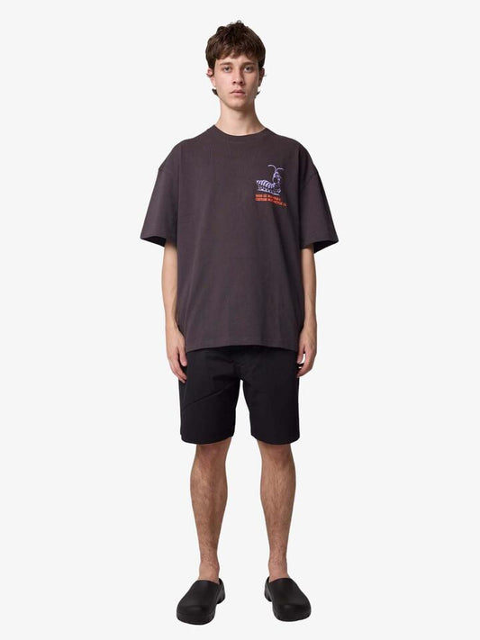 Image of a model wearing Shorts. Productname: Deus Dive Shorts in Black colour by brand - Deus