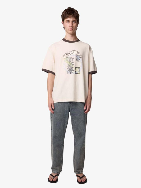 Image of a model wearing Shorts. Productname: Thrills Untamed Box Fit Oversize Short Ringer Tee in Vintage White colour by brand - Thrills