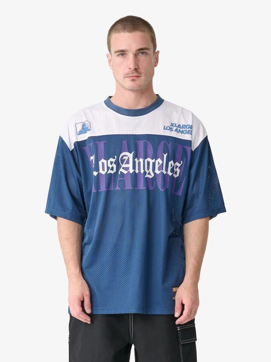 Image of a model wearing Tops. Productname: Xlarge Los Angeles Game Shirt in Dusty Navy colour by brand - Xlarge