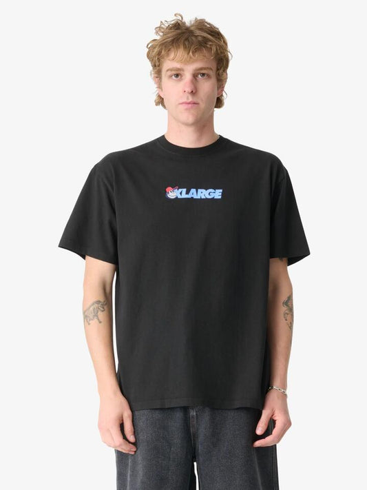 Image of a model wearing Tops. Productname: Xlarge Teach Peace Gorilla Fit Tee in Pigment Black colour by brand - Xlarge