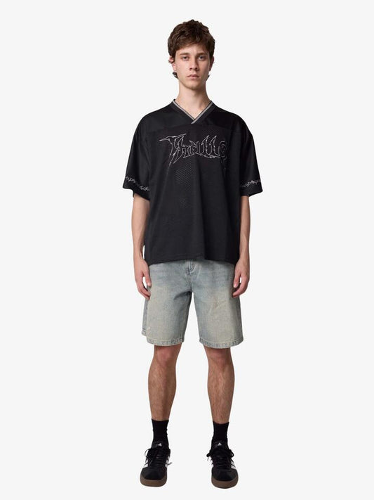 Image of a model wearing Tops. Productname: Thrills Rampage Cropped Jersey in Black colour by brand - Thrills