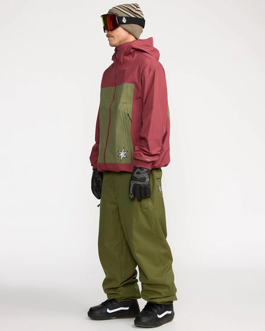 Image of a model wearing Pants. Productname: Volcom Mens Arthur 20K Snow Pants Dark Olive - in Dark Olive colour by brand - Volcom