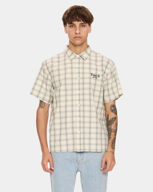 Image of a model wearing Tops. Product name - Thrills Mens Touch The Sky Check Short Sleeve Shirt Heritage White in Heritage White colour by brand - Thrills