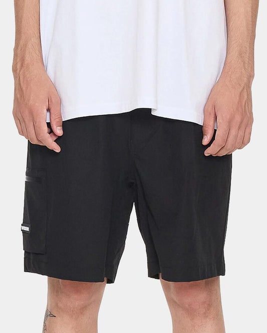 Image of a model wearing Shorts. Productname: worship Mens Core Nylon Tech Cargo Shorts Black - in Black colour by brand - Worship