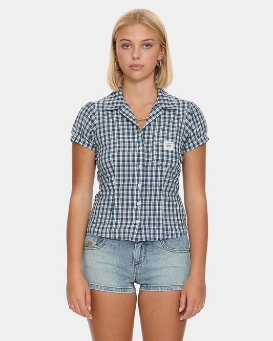 Image of a model wearing Tops. Productname: worship - Womens Checkmate Baby Short Sleeve Shirt - Blue - in Blue colour by brand - worship