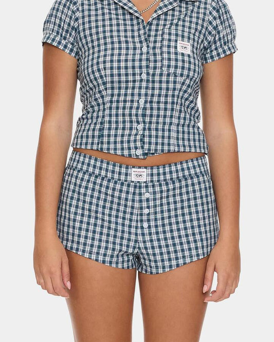 Image of a model wearing Shorts. Productname: worship - Womens Checkmate Micro Boxer Walkshorts - Blue - in Blue colour by brand - worship