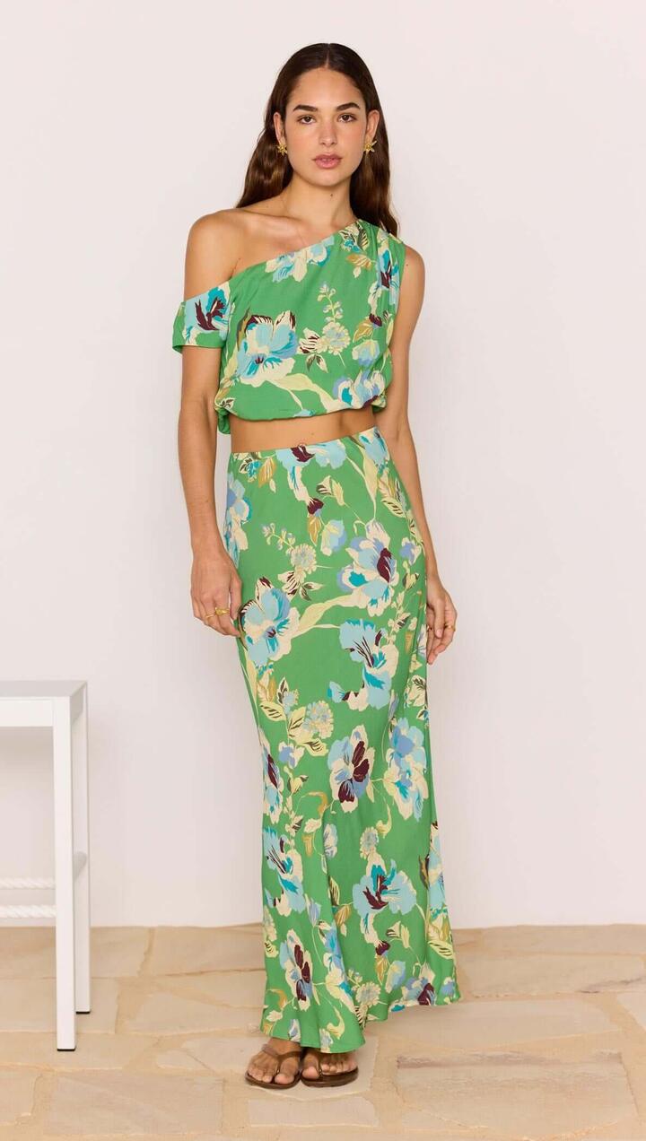Image of a model wearing Skirts. Product name - Green Floral Bias Midi Skirt in Green Floral colour by brand - MINKPINK