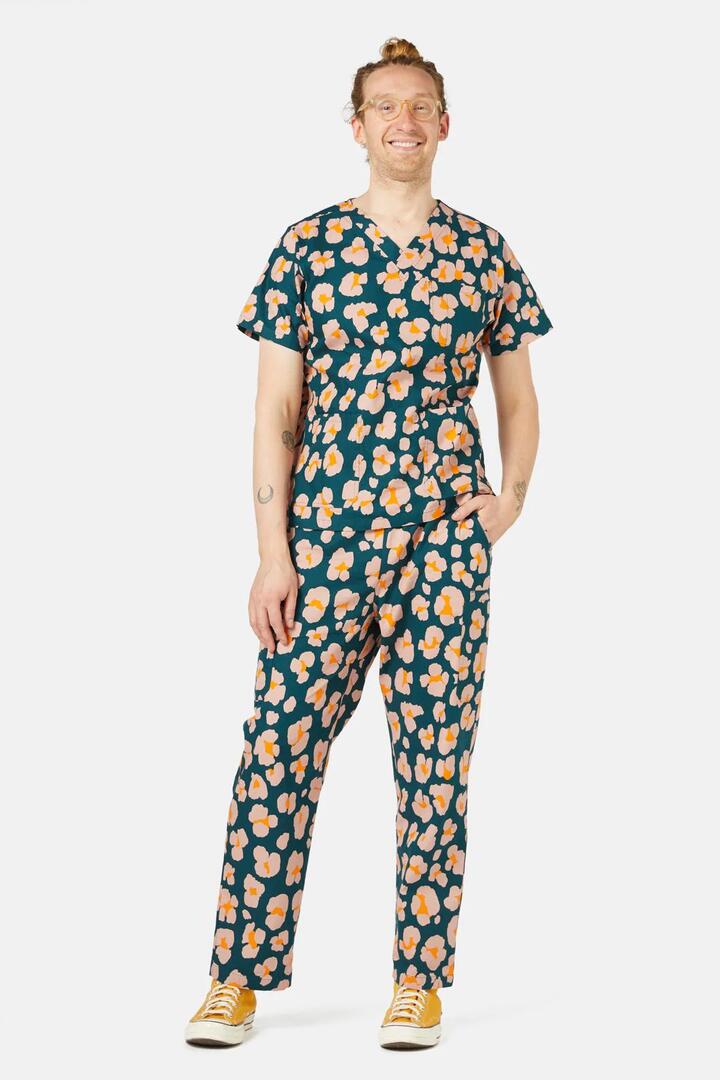 Image of a model wearing Uniforms & Workwear. Product name - Leopards Scrub Set in Green colour by brand - Gorman
