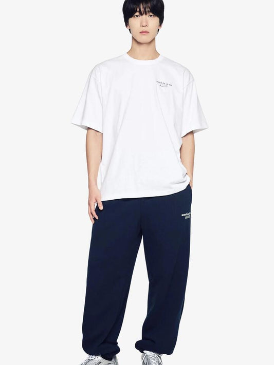 Image of a model wearing Tops. Productname: ADLV Border Line Basic Logo T-Shirt in White colour by brand - ADLV