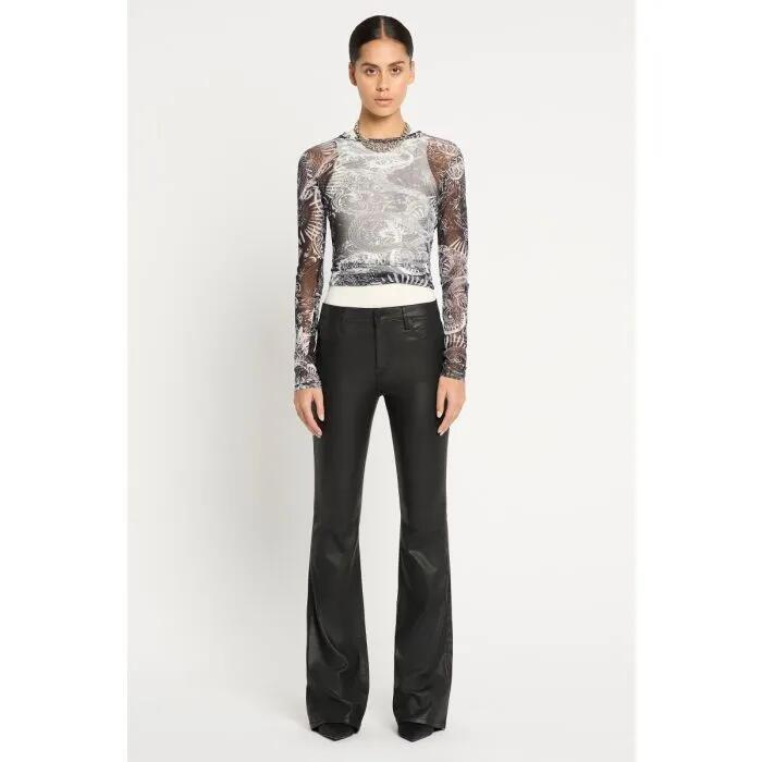 Image of a model wearing Denim. Productname: Black Magic Bootleg Jean in COATED BLACK colour by brand - sass and bide