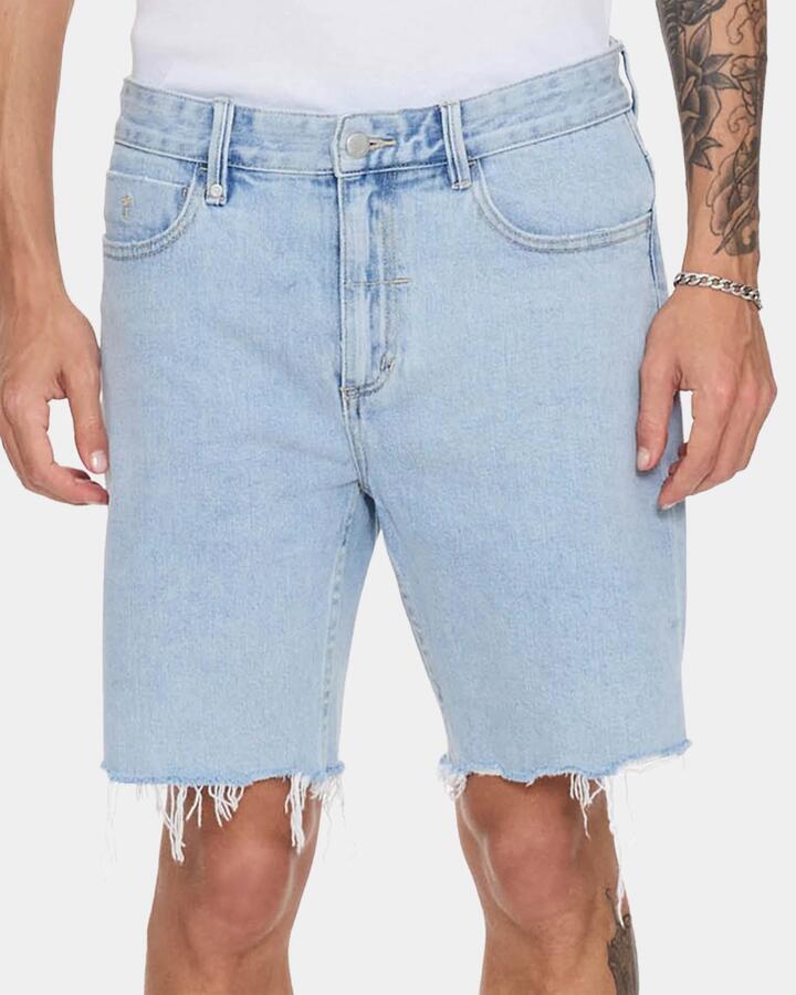 Image of a model wearing Shorts. Productname: thrills - Mens Bones Raw Slim Denim Shorts - Serenity Blue - in Serenity Blue colour by brand - thrills