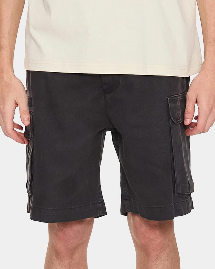 Image of a model wearing Shorts. Product name - Thrills Mens Slacker Union Relaxed Cargo Shorts Dark Charcoal in Dark Charcoal colour by brand - Thrills