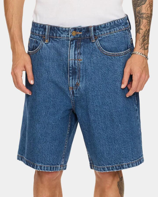 Image of a model wearing Shorts. Productname: thrills - Mens Slacker Denim Shorts - Deep Vintage Blue - in Deep Vintage Blue colour by brand - thrills