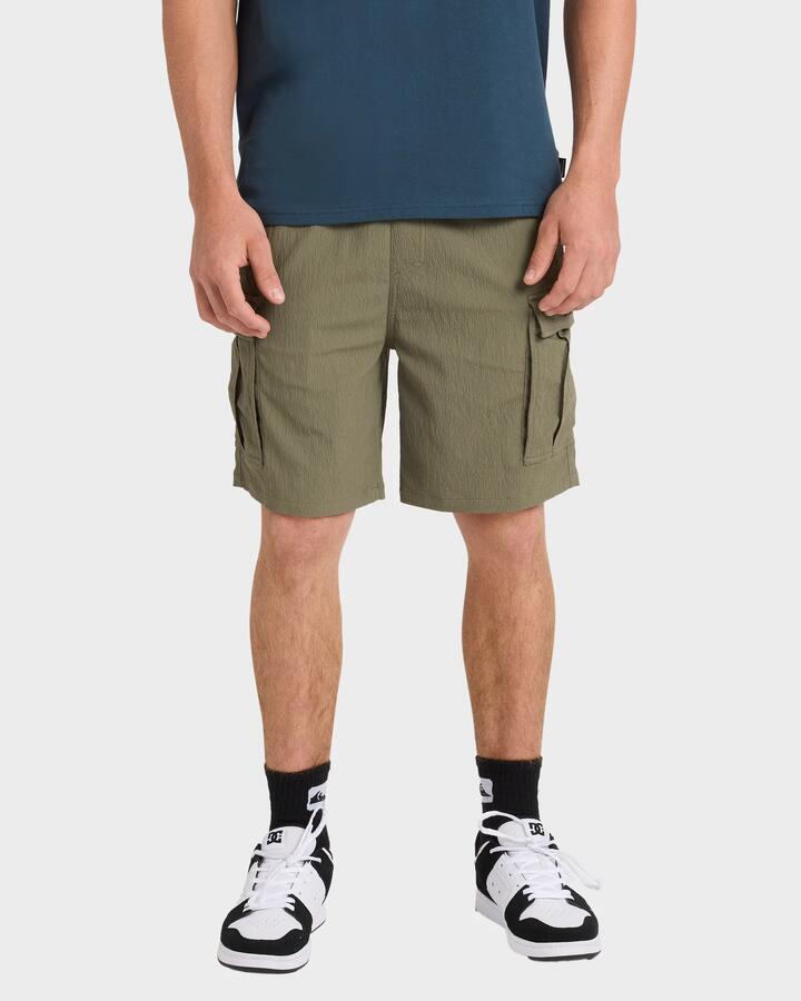 Image of a model wearing Shorts. Product name - Quiksilver Mens Watermans 19" Cargo Shorts Olive in Olive colour by brand - Quiksilver