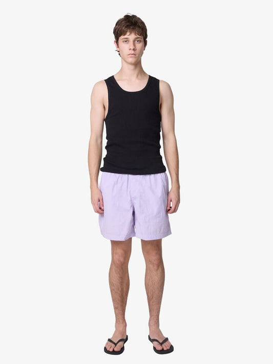 Image of a model wearing Shorts. Productname: Article One Bryn Swim Short in Mauve colour by brand - Article One