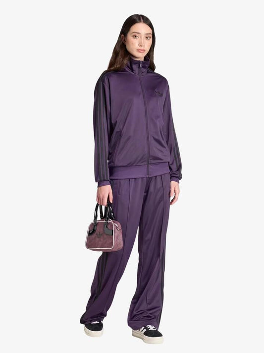 Image of a model wearing Tops. Productname: Adidas Firebird Track Top in aurora plum/black colour by brand - Adidas