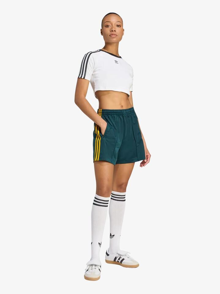 Image of a model wearing Shorts. Productname: Adidas Firebird Shorts in Aurora Ivy/Crew Yellow colour by brand - Adidas