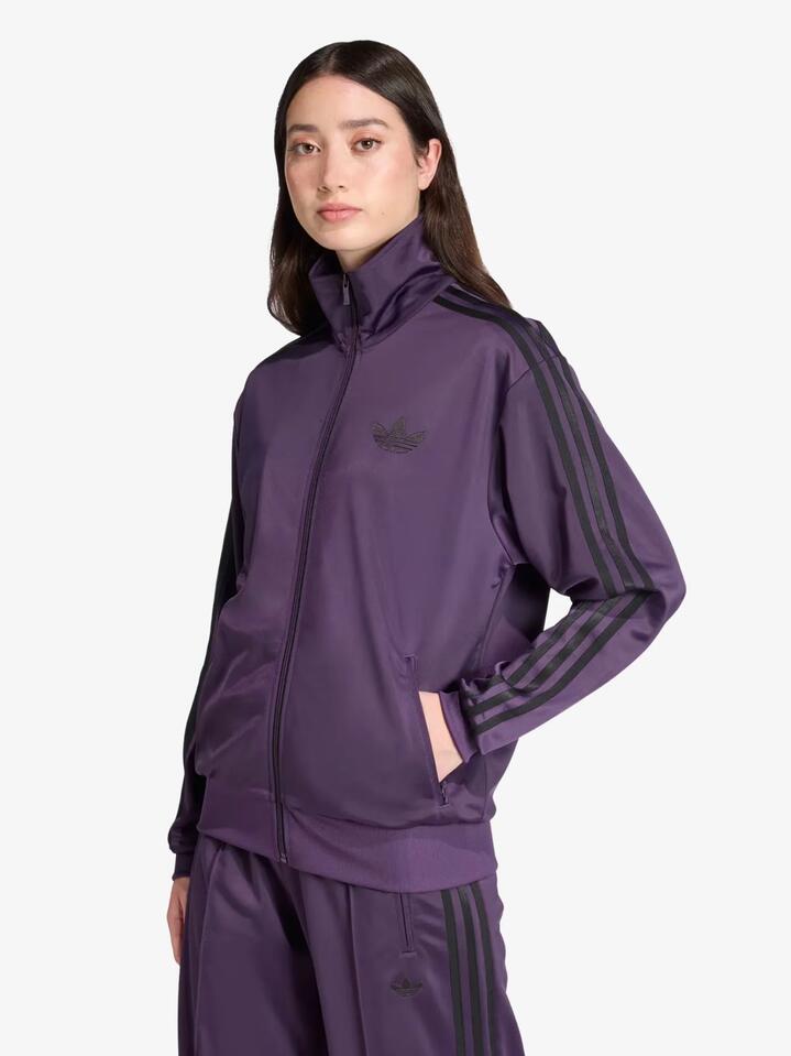 Image of a model wearing Tops. Productname: Adidas Firebird Track Top in Aurora Plum/Black colour by brand - Adidas